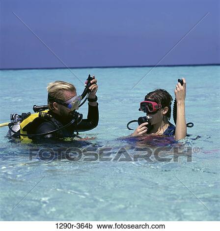 Stock Image - water, couple, outdoors, sports, water sports, scuba. Fotosearch
