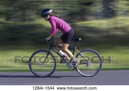 woman, bicycle, helmet, motion, outdoors, sports View Large Photo Image Picture - woman, bicycle, helmet, motion, outdoors, sports. Fotosearch