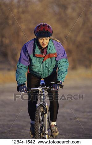 woman, bicycle, helmet, outdoors, sports, bike, cycling View Large Photo Image Stock Image - woman, bicycle, helmet, outdoors, sports, bike, cycling. Fotosearch