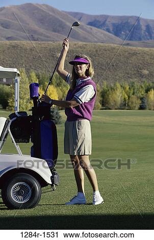 Stock Image - woman, golf, outdoors, sports, blond, golf cart. Fotosearch