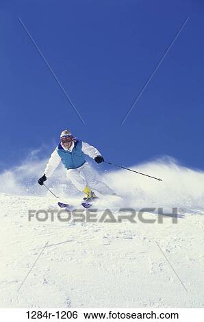 Stock Photograph - woman, skiing, outdoors, sports, winter sports, ski. Fotosearch