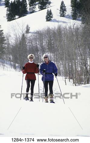 Picture - women, snow, senior, two, winter, outdoors, sports. Fotosearch