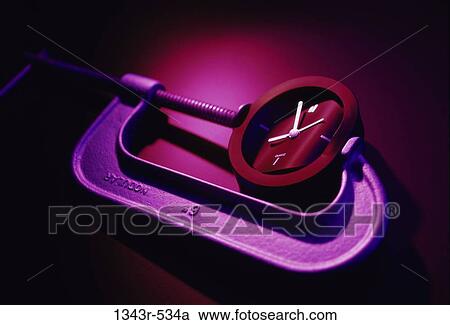 Stock Image - clock, time, squeezing, still life, press, metaphor. Fotosearch
