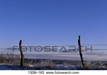 Stock Image - fence, snow, rural, winter, wire, blocking, simple. Fotosearch