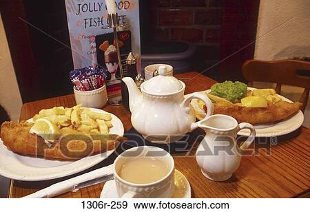 fish, table, french fries, cafe, restaurant, plates View Large Photo Image Stock Photo - fish, table, french fries, cafe, restaurant, plates. Fotosearch