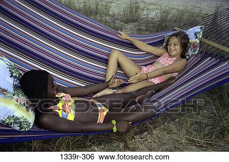 multiethnic, people, relaxation, playing, hammock, outdoors, relaxing View Large Photo Image Stock Photograph - multiethnic, people, relaxation, playing, hammock, outdoors, relaxing. Fotosearch