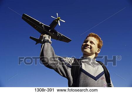 Stock Image - people, airplane, flying, boy, outdoors, child. Fotosearch