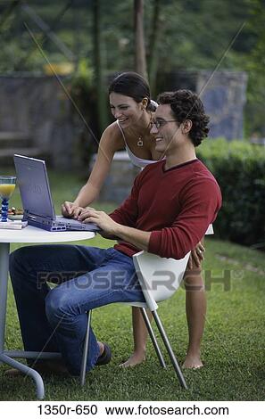 people, couple, computer, laptop, outdoors, brunette, Caucasian View Large Photo Image Stock Image - people, couple, computer, laptop, outdoors, brunette, Caucasian. Fotosearch
