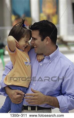 Stock Image - people, outdoors, family, father, daughter, brunette. Fotosearch