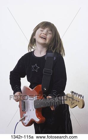 Stock Image - people, playing, music, guitar, girl, child, play. Fotosearch