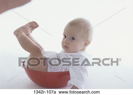 Stock Image - people, playing, sitting, baby, bowl, relaxing. Fotosearch