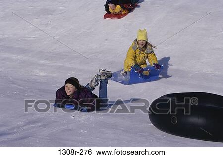 people, snow, winter, inner tube, outdoors, children View Large Photo Image Stock Photograph - people, snow, winter, inner tube, outdoors, children. Fotosearch