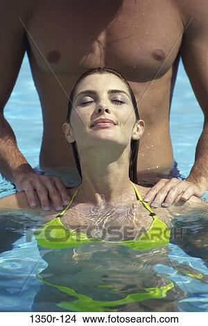 Picture - people, swim, pool, couple, swimming, outdoors, relaxing. Fotosearch