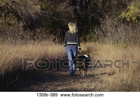 people, walking, pet, outdoors, path, blond View Large Photo Image Stock Photo - people, walking, pet, outdoors, path, blond. Fotosearch