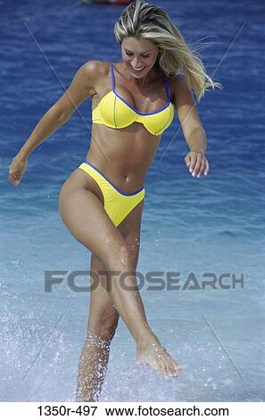 people, water, woman, ocean, yellow, beach, splash View Large Photo Image Stock Photo - people, water, woman, ocean, yellow, beach, splash. Fotosearch