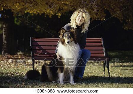 people, woman, autumn, dog, bench, sitting View Large Photo Image Stock Photo - people, woman, autumn, dog, bench, sitting. Fotosearch