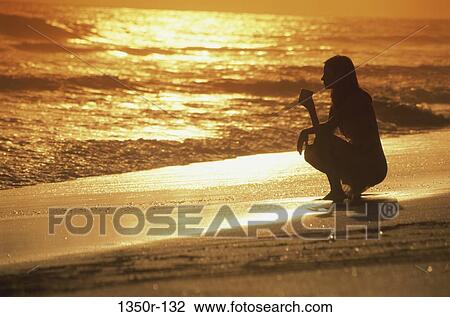 Stock Image - people, woman, beach, silhouette, moods, young adult. Fotosearch