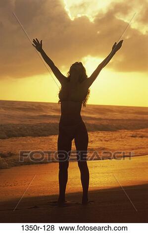 Stock Photo - people, woman, beach, silhouette, moods, young adult. Fotosearch