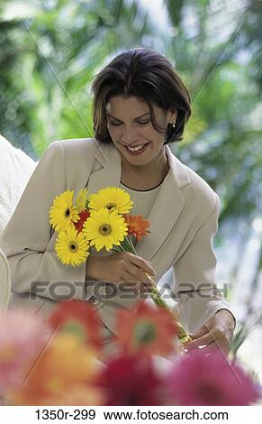 people, woman, daisies, flowers, outdoors, brunette View Large Photo Image Stock Photo - people, woman, daisies, flowers, outdoors, brunette. Fotosearch