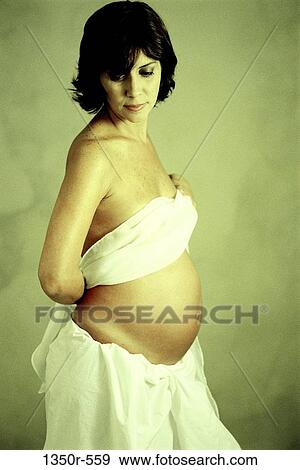 people, woman, Hispanic, stomach, holding, waiting, brunette View Large Photo Image Stock Photo - people, woman, Hispanic, stomach, holding, waiting, brunette. Fotosearch