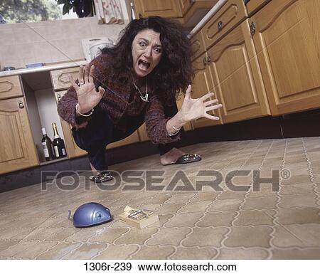 Stock Photo - people, woman, mouse, computer, fear, Middle-aged. Fotosearch