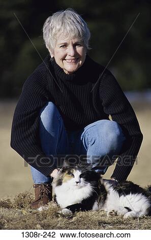 people, woman, senior, cat, pet, outdoors, animal View Large Photo Image Stock Image - people, woman, senior, cat, pet, outdoors, animal. Fotosearch