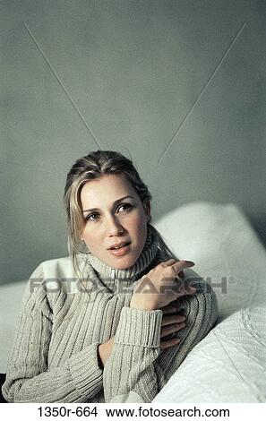 people, woman, sitting, couch, indoors, Caucasian View Large Photo Image Picture - people, woman, sitting, couch, indoors, Caucasian. Fotosearch