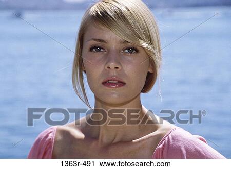 people, woman, staring, outdoors, serious, blond View Large Photo Image Stock Image - people, woman, staring, outdoors, serious, blond. Fotosearch