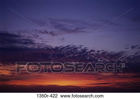 Stock Image - sky, clouds, sunset, nature, horizon, vibrant. Fotosearch