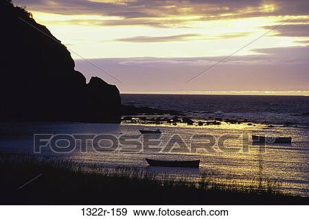 water, clouds, sunset, nature, rocks, boat, harbor View Large Photo Image Stock Photo - water, clouds, sunset, nature, rocks, boat, harbor. Fotosearch
