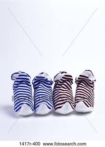Stock Image - baby, stripes, slippers, socks, square, striped, still life. Fotosearch