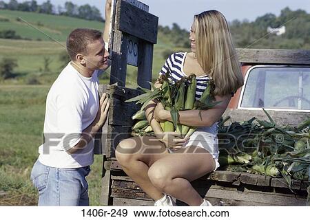 Stock Photo - corn, attentive, people, couple, holding, flirting. Fotosearch