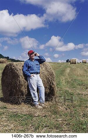 Stock Image - Field, farm, farming, people, harvest, telephone. Fotosearch