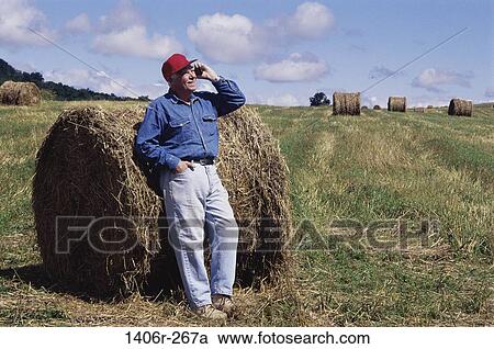 Stock Image - Field, people, telephone, farmer, talking. Fotosearch