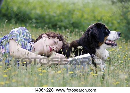 Field, people, woman, dog, reading, pet View Large Photo Image Stock Photo - Field, people, woman, dog, reading, pet. Fotosearch