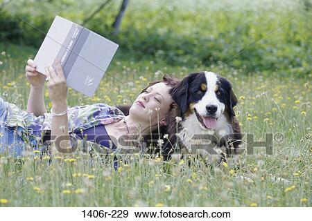 Field, people, woman, dog, reading, pet, book View Large Photo Image Stock Photo - Field, people, woman, dog, reading, pet, book. Fotosearch