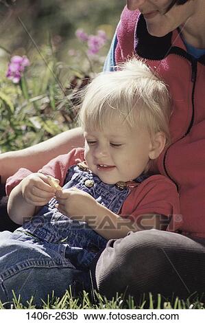 grass, people, sitting, mother, leaning, outdoors, curious View Large Photo Image Stock Image - grass, people, sitting, mother, leaning, outdoors, curious. Fotosearch