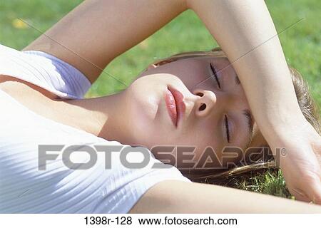 grass, people, sleeping, outdoors, teenager, female View Large Photo Image Stock Photo - grass, people, sleeping, outdoors, teenager, female. Fotosearch