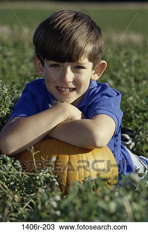 grass, people, smiling, autumn, pumpkin, boy, outdoors View Large Photo Image Stock Image - grass, people, smiling, autumn, pumpkin, boy, outdoors. Fotosearch