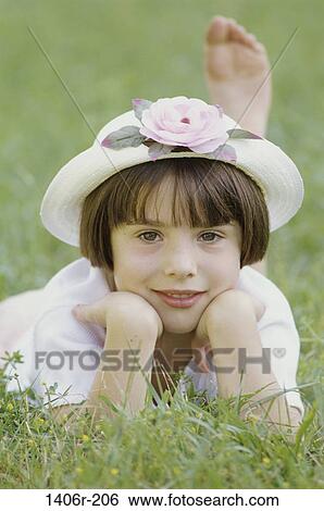 grass, people, smiling, hat, girl, flower, summer View Large Photo Image Stock Photograph - grass, people, smiling, hat, girl, flower, summer. Fotosearch