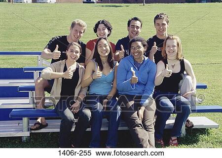 multiethnic, people, smiling, sitting, outdoors, friends View Large Photo Image Stock Photography - multiethnic, people, smiling, sitting, outdoors, friends. Fotosearch