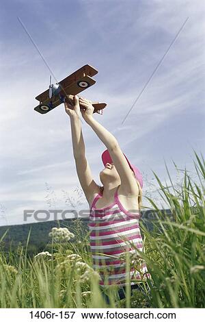 people, airplane, playing, girl, outdoors, child, play View Large Photo Image Stock Photo - people, airplane, playing, girl, outdoors, child, play. Fotosearch