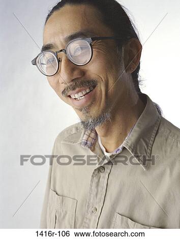 people, Asian, eyeglasses, earring, Middle-aged, portrait View Large Photo Image Stock Photograph - people, Asian, eyeglasses, earring, Middle-aged, portrait. Fotosearch