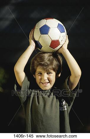 Stock Photography - people, balance, head, ball, holding, boy, outdoors. Fotosearch