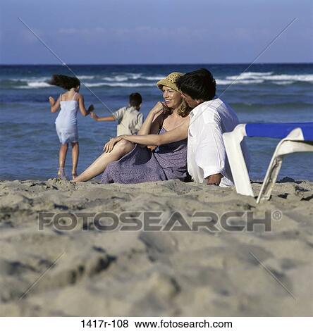 people, beach, family, clothed, parents View Large Photo Image Stock Photo - people, beach, family, clothed, parents. Fotosearch
