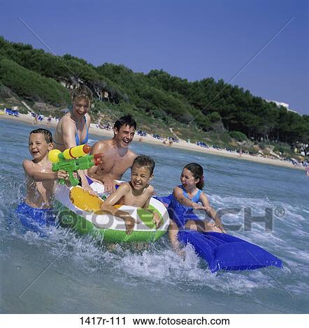 people, beach, family, vacation, brunette, parents View Large Photo Image Stock Image - people, beach, family, vacation, brunette, parents. Fotosearch