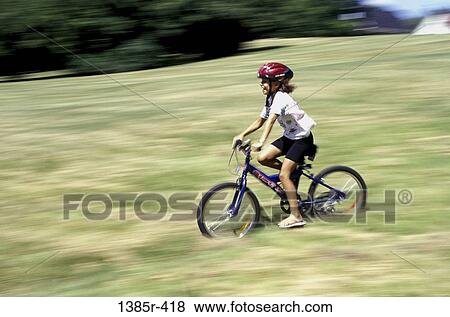 people, blur, bicycle, helmet, riding, girl View Large Photo Image Stock Photo - people, blur, bicycle, helmet, riding, girl. Fotosearch
