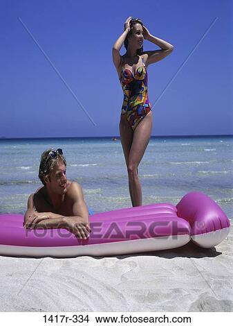 people, couple, beach, relaxing, square, vacation, float View Large Photo Image Picture - people, couple, beach, relaxing, square, vacation, float. Fotosearch