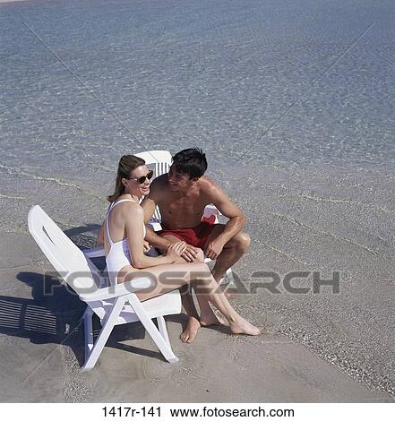 people, couple, sitting, beach, chairs View Large Photo Image Stock Image - people, couple, sitting, beach, chairs. Fotosearch