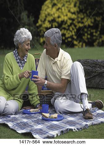people, eating, ground, couple, sitting, senior View Large Photo Image Picture - people, eating, ground, couple, sitting, senior. Fotosearch